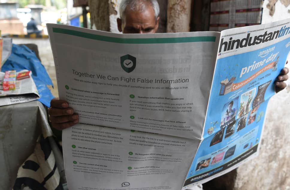 A Man holding a newspaper,  govt advert on fake news prevention in India, gauravsinhawrites.in