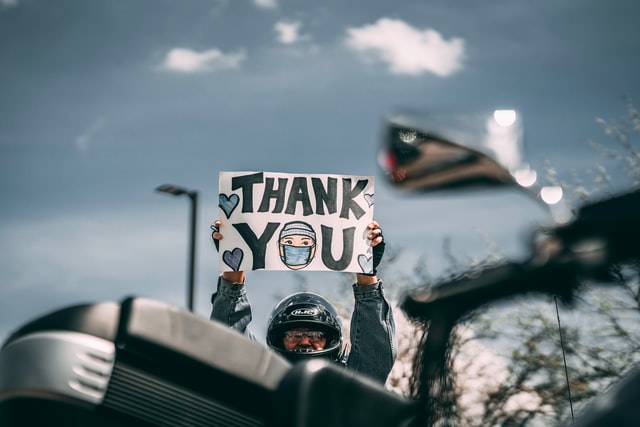 A biker showing Thank You Placard. 
Thank Yourself blog article by Gaurav Sinha