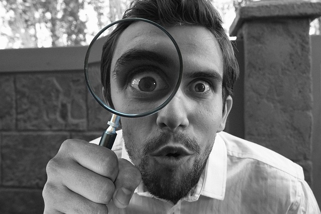A man with a magnifying glass. We can discover a lot by looking within - Indian Author Gaurav Sinha www.gauravsinhawrites.in