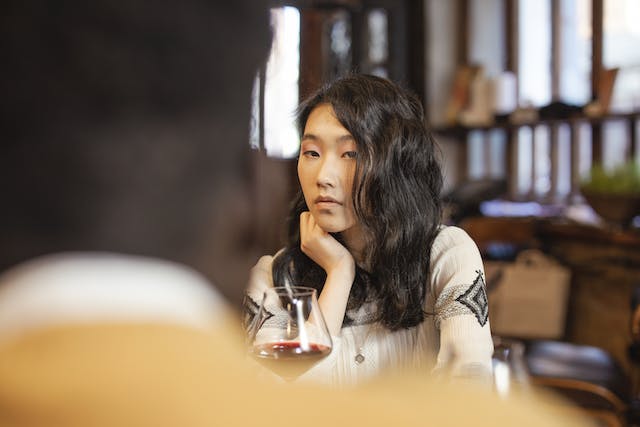 An asian girl looking at someone. Beyond the Surface: Navigating First Impressions and Avoiding Misjudgments blog post by Gaurav Sinha